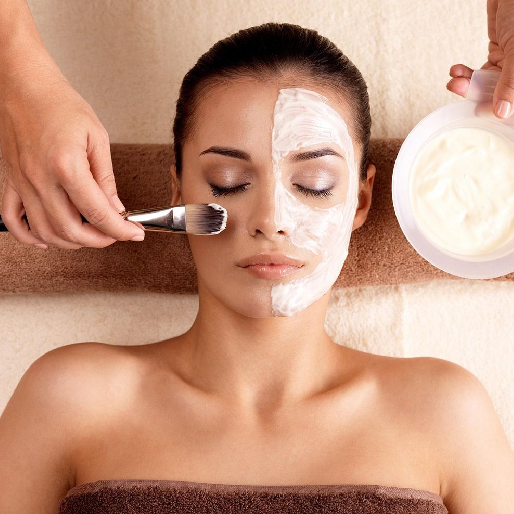 Client receiving a medi facial mask